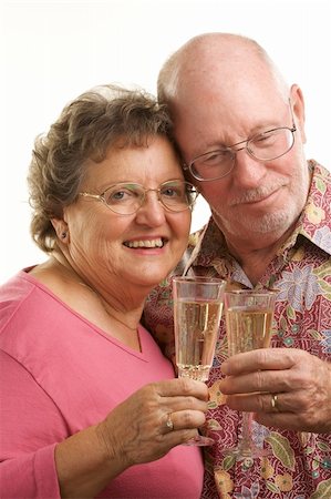 simsearch:400-04522125,k - Happy Senior Couple toasting with Champagne glasses. Stock Photo - Budget Royalty-Free & Subscription, Code: 400-04522135