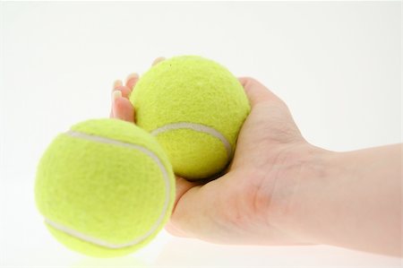 hand with two tennis balls Foto de stock - Super Valor sin royalties y Suscripción, Código: 400-04522313