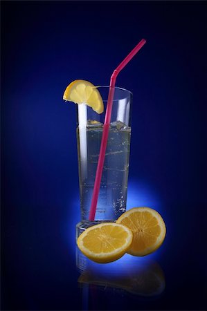 simsearch:400-04522626,k - Alcohol cocktail with ice cubes and slices of lemon. Photographie de stock - Aubaine LD & Abonnement, Code: 400-04522627
