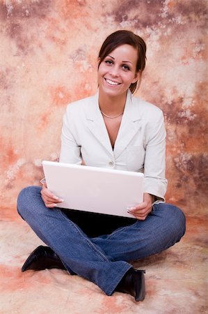 feet sofa comfort - Happy girl with white laptop computer Stock Photo - Budget Royalty-Free & Subscription, Code: 400-04522708