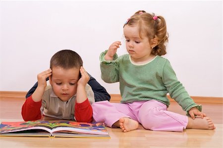 Two kids reading the tale book Stock Photo - Budget Royalty-Free & Subscription, Code: 400-04522864