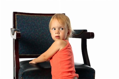 little beauty girl stand near elbow-chair lean it's elbows look around and look back Photographie de stock - Aubaine LD & Abonnement, Code: 400-04522904