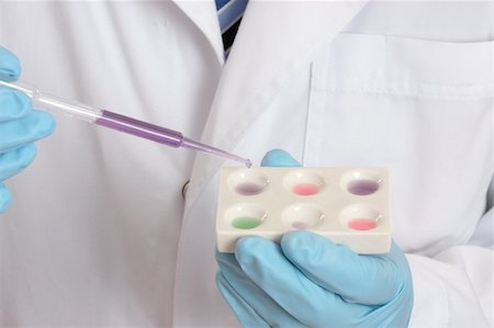 simsearch:400-04962353,k - A medical, forensic or laboratory scientist using a spot plate and pipette during laboratory research.  Focus to hands and pipette. Stock Photo - Budget Royalty-Free & Subscription, Code: 400-04523059