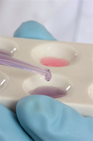 simsearch:400-04962353,k - Science, medical or chemistry analysis.   Dropping a  fluid substance from pipette into a spot well plate.  Focus ti pipette Stock Photo - Budget Royalty-Free & Subscription, Code: 400-04523060