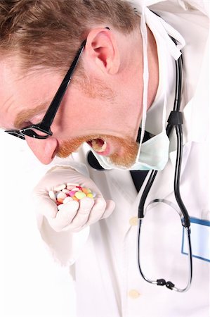 simsearch:400-05728493,k - doctor taking hand full of tablets on white background Photographie de stock - Aubaine LD & Abonnement, Code: 400-04523086