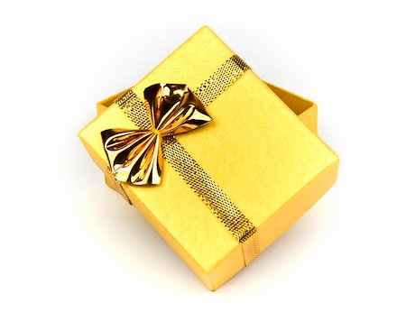Shining gold gift box isolated on white Stock Photo - Budget Royalty-Free & Subscription, Code: 400-04523141