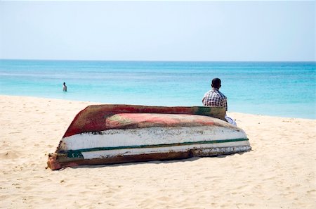 A handsome and happy fortysomething man is smiling as he is having a great beach holiday. Stock Photo - Budget Royalty-Free & Subscription, Code: 400-04523155