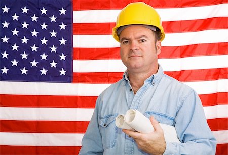 simsearch:400-03993687,k - Construction worker with blueprints in front of an American flag.  Photographed in front of the flag, not a composite image. Foto de stock - Super Valor sin royalties y Suscripción, Código: 400-04523332