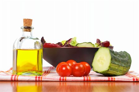 Mediterranean salad with lettuce tomatoes cucumber oil and beet Stock Photo - Budget Royalty-Free & Subscription, Code: 400-04534164