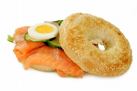 eating a bagel sandwich - Bagel with salmon on bright background Stock Photo - Budget Royalty-Free & Subscription, Code: 400-04534170