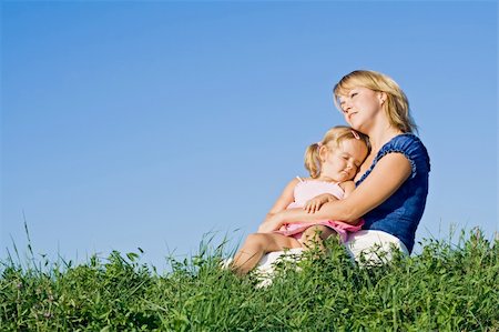 simsearch:400-04795754,k - Woman and little girl enjoying the late summer sunshine outdoors Stock Photo - Budget Royalty-Free & Subscription, Code: 400-04534211