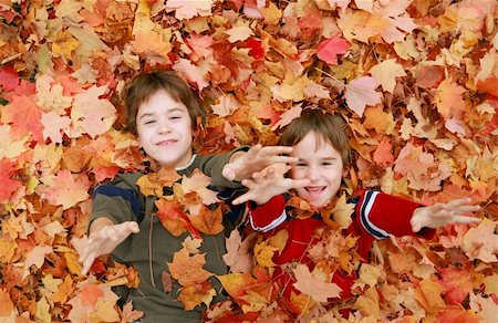 simsearch:400-05045912,k - Boys Having Fun Throwing Leaves Stock Photo - Budget Royalty-Free & Subscription, Code: 400-04534432