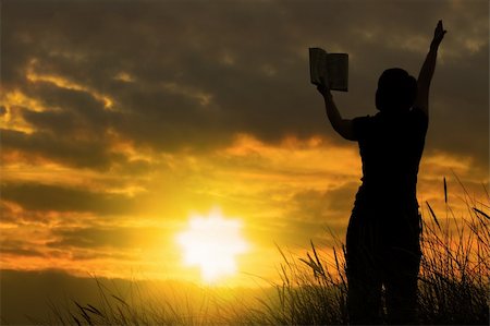 simsearch:400-04662543,k - female praying with bible against summer sunset, person isn't identifable Stock Photo - Budget Royalty-Free & Subscription, Code: 400-04534545