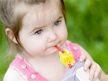 Nice 2 year old girl drinking juice Stock Photo - Budget Royalty-Free & Subscription, Code: 400-04534834