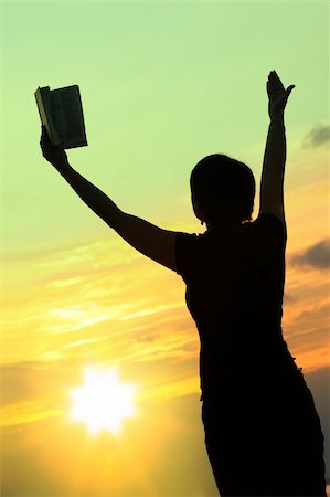 simsearch:400-05065940,k - female praying with bible against summer sunset, person isn't identifable Stock Photo - Budget Royalty-Free & Subscription, Code: 400-04534865