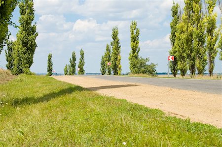 a turn of rural road is to the left with the image of sign-boards Stock Photo - Budget Royalty-Free & Subscription, Code: 400-04534984