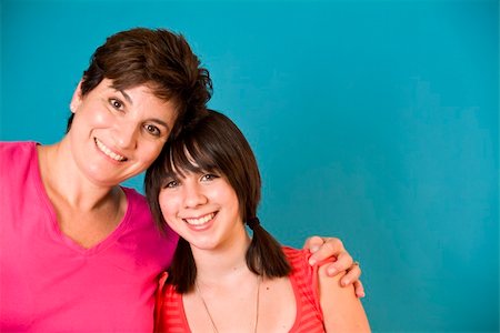 simsearch:400-06517383,k - A woman and a girl representing a happy mother and daughter. (blue screen) Fotografie stock - Microstock e Abbonamento, Codice: 400-04535276