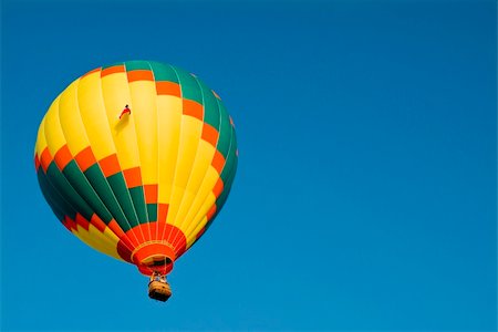 simsearch:400-08032526,k - A colorful hot air balloon floating in a bright blue sky. Foto de stock - Super Valor sin royalties y Suscripción, Código: 400-04535281