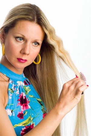 straight hair brushing - Long hair blonde woman with hairbrush in her hand Photographie de stock - Aubaine LD & Abonnement, Code: 400-04535486
