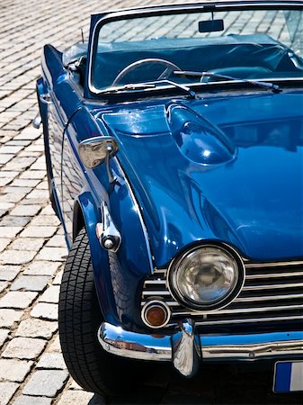 Blue Oldtimer in perfect condition posing on a street Stock Photo - Budget Royalty-Free & Subscription, Code: 400-04535670