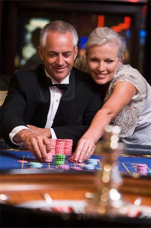 Couple gambling at roulette table in casino Stock Photo - Budget Royalty-Free & Subscription, Code: 400-04535891