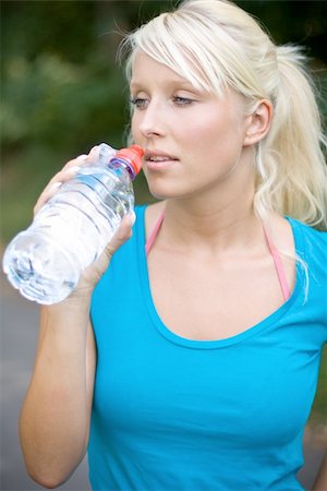 exhausted sweaty female runner - cool water after the long run Stock Photo - Budget Royalty-Free & Subscription, Code: 400-04535937