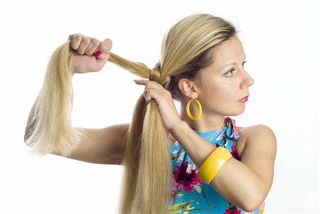 straight hair brushing - Long hair blonde woman braids one's hair Foto de stock - Super Valor sin royalties y Suscripción, Código: 400-04536007