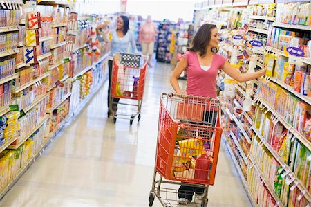 Two women shopping in supermarket grocery aisle Stock Photo - Budget Royalty-Free & Subscription, Code: 400-04536036