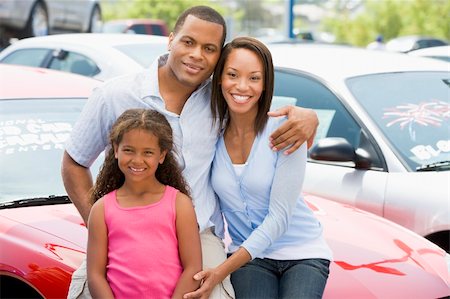forecourt - Family on new car lot looking to camera Stock Photo - Budget Royalty-Free & Subscription, Code: 400-04536056