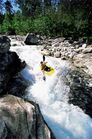 Young man kayaking in rapids Stock Photo - Budget Royalty-Free & Subscription, Code: 400-04536317