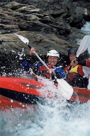 simsearch:400-04536316,k - Two people paddling inflatable boat down rapids Foto de stock - Super Valor sin royalties y Suscripción, Código: 400-04536321
