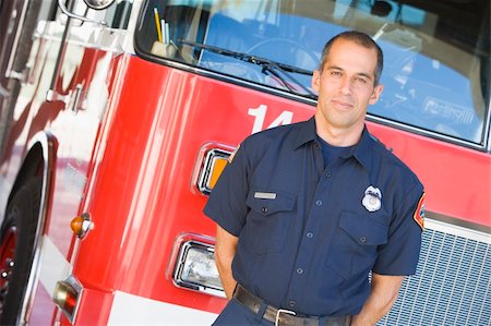 fire station - Portrait of a firefighter by a fire engine Stock Photo - Budget Royalty-Free & Subscription, Code: 400-04536344