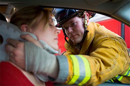 fireman driver pictures - Firefighters helping an injured woman in a car Stock Photo - Budget Royalty-Free & Subscription, Code: 400-04536365