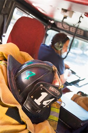 simsearch:640-01358080,k - Firefighters travelling to an emergency Stock Photo - Budget Royalty-Free & Subscription, Code: 400-04536361