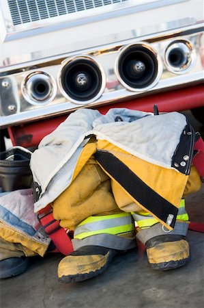 empty her wellies photography - Empty firefighter's boots and uniform next to fire engine Stock Photo - Budget Royalty-Free & Subscription, Code: 400-04536371