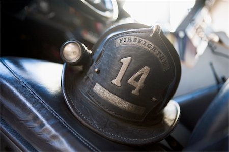 fire truck close - Vintage firefighter's helmet Stock Photo - Budget Royalty-Free & Subscription, Code: 400-04536372