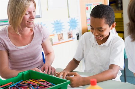 simsearch:400-04536422,k - A schoolboy and his teacher in an art class Foto de stock - Super Valor sin royalties y Suscripción, Código: 400-04536421