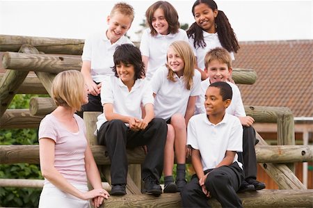 simsearch:400-04036581,k - School children sitting on benches outside with their teacher Stock Photo - Budget Royalty-Free & Subscription, Code: 400-04536432