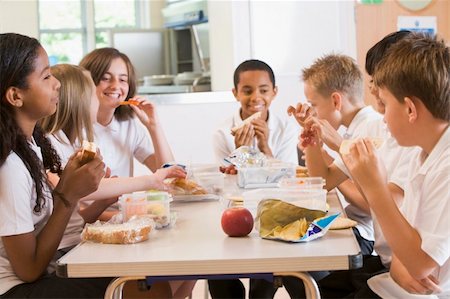 friends table indoor dinner - Schoolchildren enjoying their lunch in a school cafeteria Stock Photo - Budget Royalty-Free & Subscription, Code: 400-04536441