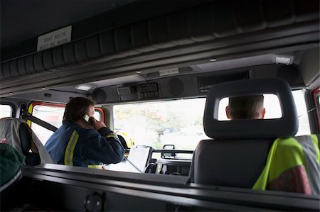 fireman driver pictures - Firefighters on their way to an emergency scene Photographie de stock - Aubaine LD & Abonnement, Code: 400-04536488