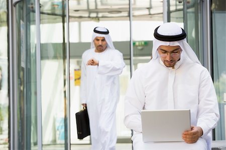 simsearch:400-04037075,k - A Middle Eastern businessman sitting with a laptop Stock Photo - Budget Royalty-Free & Subscription, Code: 400-04536802
