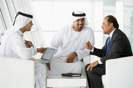 simsearch:400-04037075,k - Three Middle Eastern men talking at a business meeting Stock Photo - Budget Royalty-Free & Subscription, Code: 400-04536814