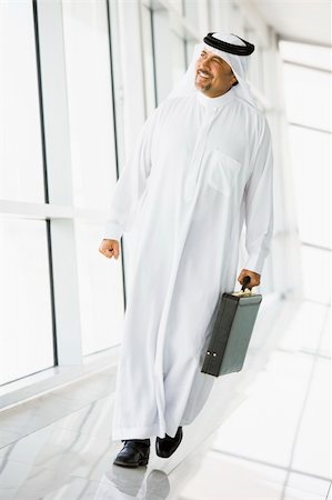 simsearch:400-04037075,k - A Middle Eastern businessman walking in a corridor Stock Photo - Budget Royalty-Free & Subscription, Code: 400-04536816