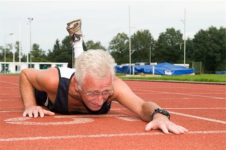 Active senior finally made it to the finish line. Stock Photo - Budget Royalty-Free & Subscription, Code: 400-04536876