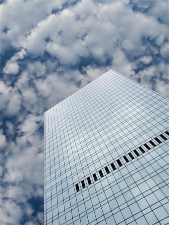 simsearch:400-03978588,k - High modern skyscraper on a background of a blue sky and clouds. Stockbilder - Microstock & Abonnement, Bildnummer: 400-04537129