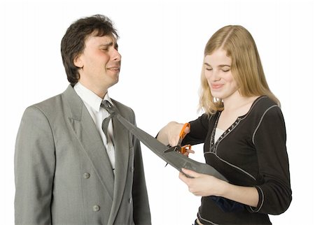 female humiliating male photo - Pretty woman cutting man's necktie with scissors Stock Photo - Budget Royalty-Free & Subscription, Code: 400-04537717