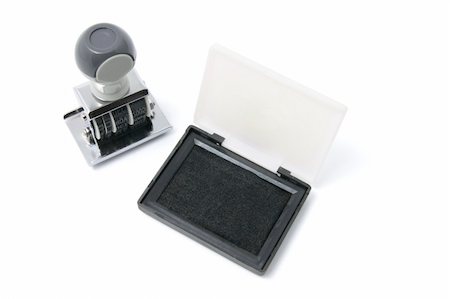Rubber Stamp and Ink Pad on White Backgroiund Foto de stock - Royalty-Free Super Valor e Assinatura, Número: 400-04537865