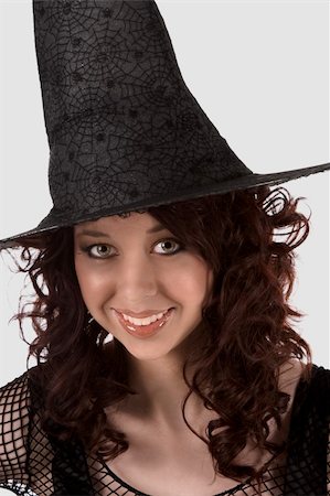 simsearch:400-04007612,k - Portrait of Hispanic teenager girl in black Halloween hat and fishnet dress Stock Photo - Budget Royalty-Free & Subscription, Code: 400-04537914