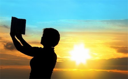 simsearch:400-04662543,k - female praying with bible against summer sunset, person isn't identifable Stock Photo - Budget Royalty-Free & Subscription, Code: 400-04538000