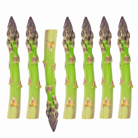 simsearch:400-05065763,k - Seven asparagus spears in an abstract design on a vertical axis with one spear in the reverse direction. Over white background. Stockbilder - Microstock & Abonnement, Bildnummer: 400-04538030